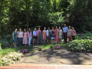 photo of 14 members of the MC3 program team taken outdoors in the summer of 2022