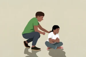 Illustration of an upset child sitting on the floor with their parent crouching behind them to comfort them.