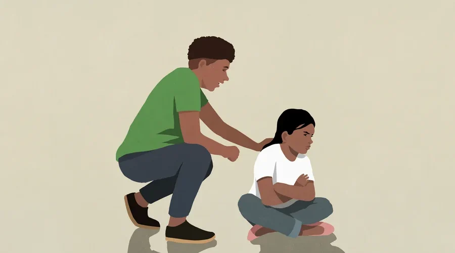 Illustration of an upset child sitting on the floor with their parent crouching behind them to comfort them.